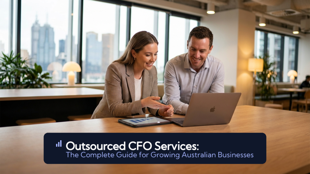 A finance professional and business owner reviewing dashboards on a laptop in a warm, modern Australian office
